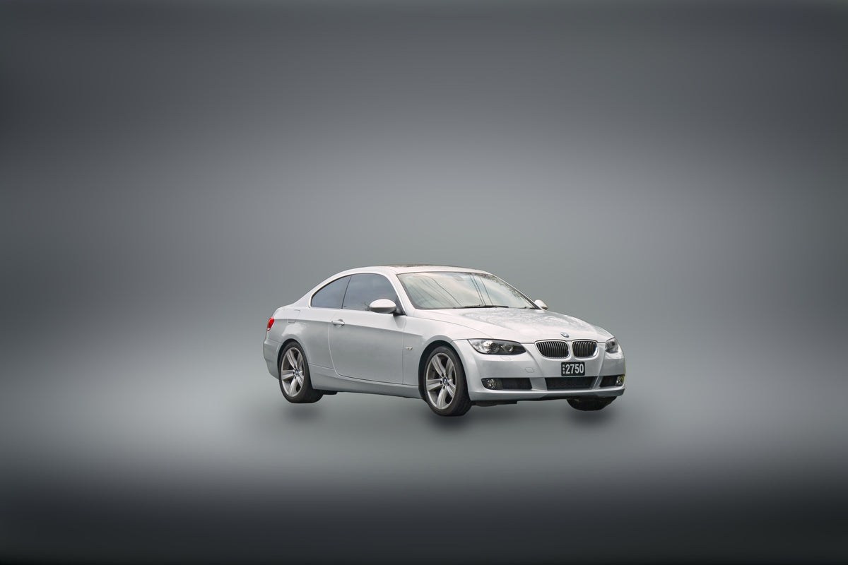 BMW 3 Series E90-generation coupé in white
